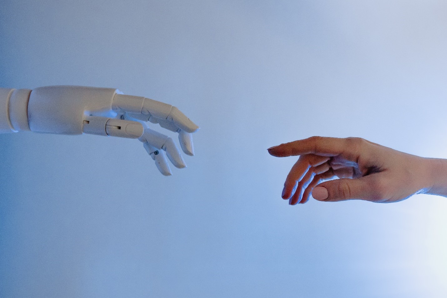 ai and real hand touching